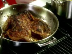 A mojito chicken that has been marinated, given a dry rub, and cooked in a pan.