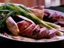 A plate of jalapeno sausages cooked in corn husks. This is from RJ's Bob-Be-Que shack in Mission, KS.