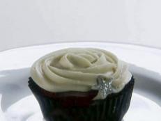 A red Velvet Cupcakes with Almond Cream Cheese Frosting is served.