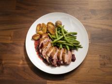 Co-hosts Anne Burrell and Jeff Mauros' duck with string beans and potatoes with cherry sauce, as seen on Worst Cooks In America, Season 26.