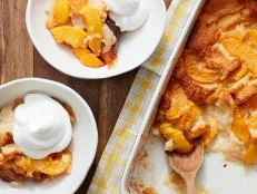 Description: Trisha Yearwood's Easy Peach Cobbler. Keywords: Peaches, Butter, Self-Rising Flour, Sugar, Milk, Whipping Cream