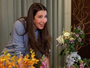 Jen Agg with some flowers arranged in front of her