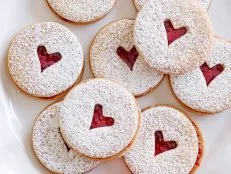 MINI LINZER COOKIES
Ina Garten
Barefoot Contessa/Card Sharks’ Delight
Food Network
Unsalted Butter, Granulated Sugar, Vanilla Extract, Flour, Salt, Raspberry Preserves,
Confectioners’ Sugar