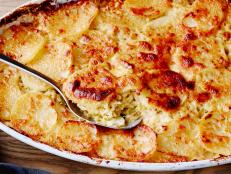 THE ULTIMATE POTATO GRATIN
Tyler Florence
Tyler’s Ultimate/Potato Dish
Food Network
Savoy Cabbage, Slab Bacon, Unsalted Butter, Garlic, Fresh Chives, Sea Salt, Pepper, Baking
Potatoes, Heavy Cream, Parmesan Cheese
