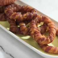 Bacon-wrapped onion rings, as seen on Food Network's The Kitchen.
