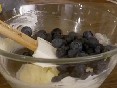 Blueberries set in a bowl on top of the filling for turnovers.