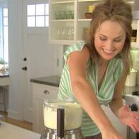 Giada blends ingredients in a blender to make her cheesecake squares.