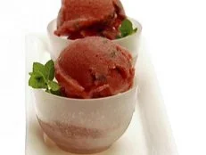 A pomegrante sorbet is served for dessert.