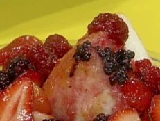 Angelic cake and berries prepared by Rachael Ray.