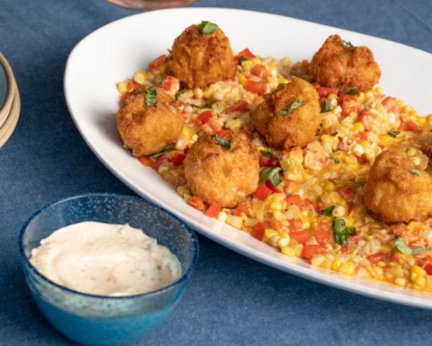 Cheesy Shrimp Scampi Beignets with Corn Maque Choux and Basil Remoulade image