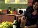 Host and chef Rachael Ray rims a glass for a cocktail
