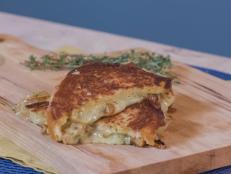 How to elevate the classic grilled cheese? How about filling thick slices of brioche with three cheeses, fresh herbs, a splash of prosecco and a spoonful of Dijon mustard? Add a jammy onion spread inspired by the flavors of French onion soup and you've got one unbeatable sandwich!
