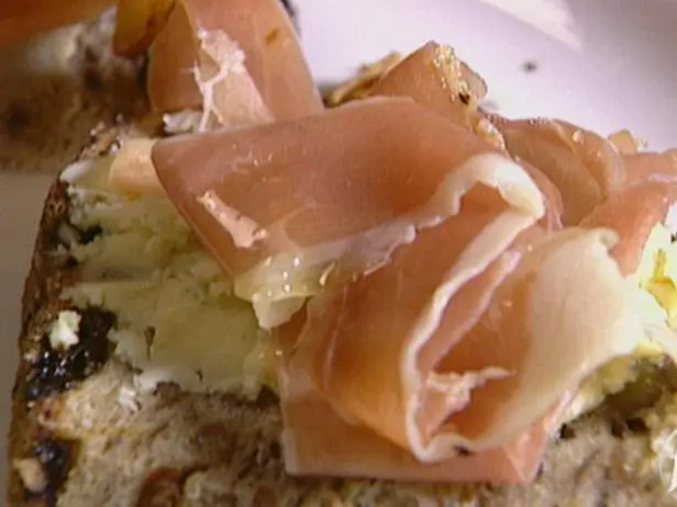 Walnut Bread Crostini with Sauteed Pear, Prosciutto, Gorgonzola Cheese and a Balsamic-Port Reduction