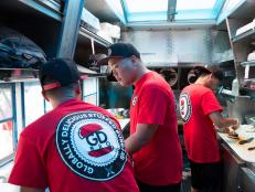 Team GD Bro's Mark Cruz, Kevin Nguyen, and Geoffrey Manila prepare for the selling challenge in Lake Havasu City, Arizona, as seen on Food Network's The Great Food Truck Race, Season 6.